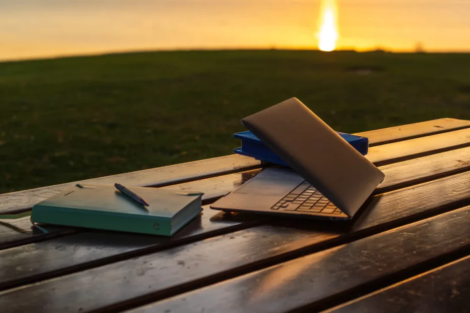 Laptop on a table located near a lake in Switzerland