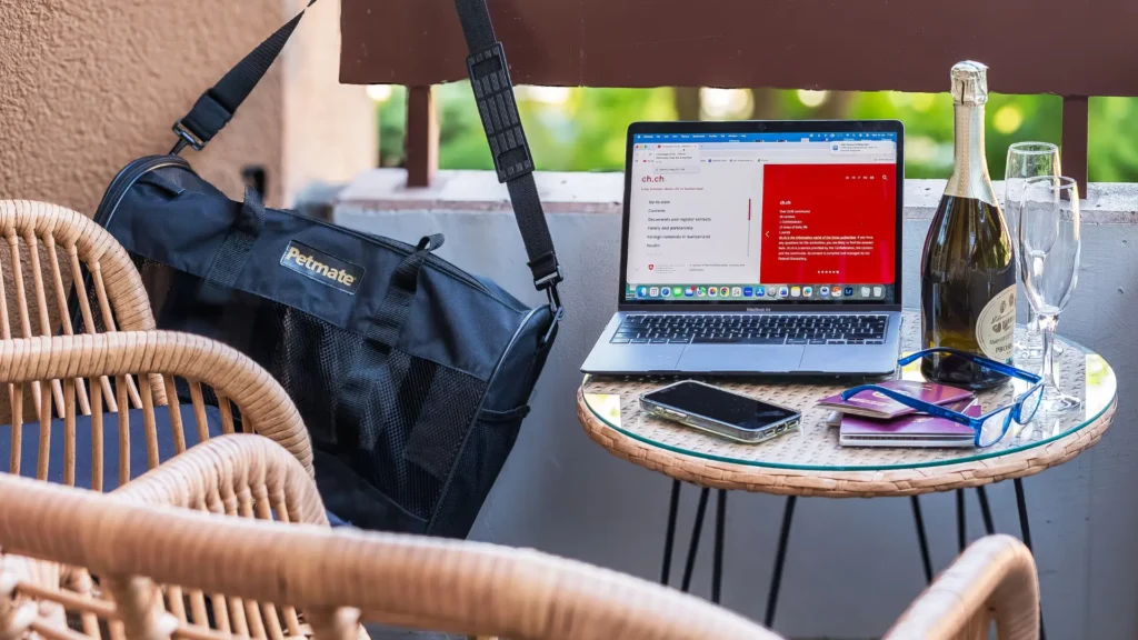 photo of a balcony with bag, swiss passports