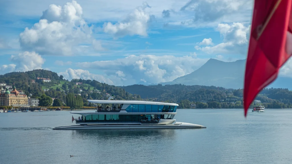 the photo with the Swiss boat and nature (centered position) 