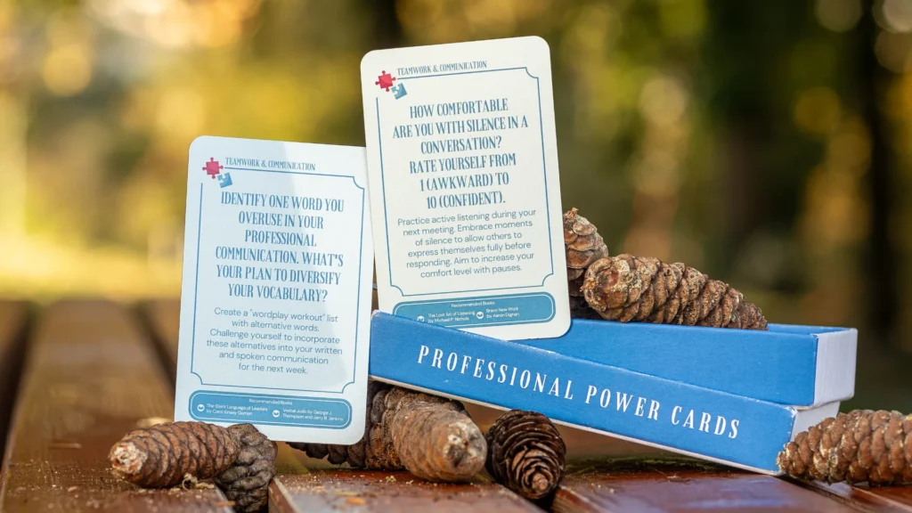 Professional Power Cards resting on pinecones outdoors, a self-coaching tool for workplace communication.